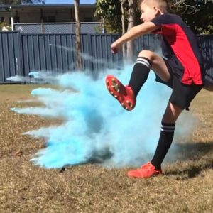 Kids soccer gender reveal ideas with blue Holi powder