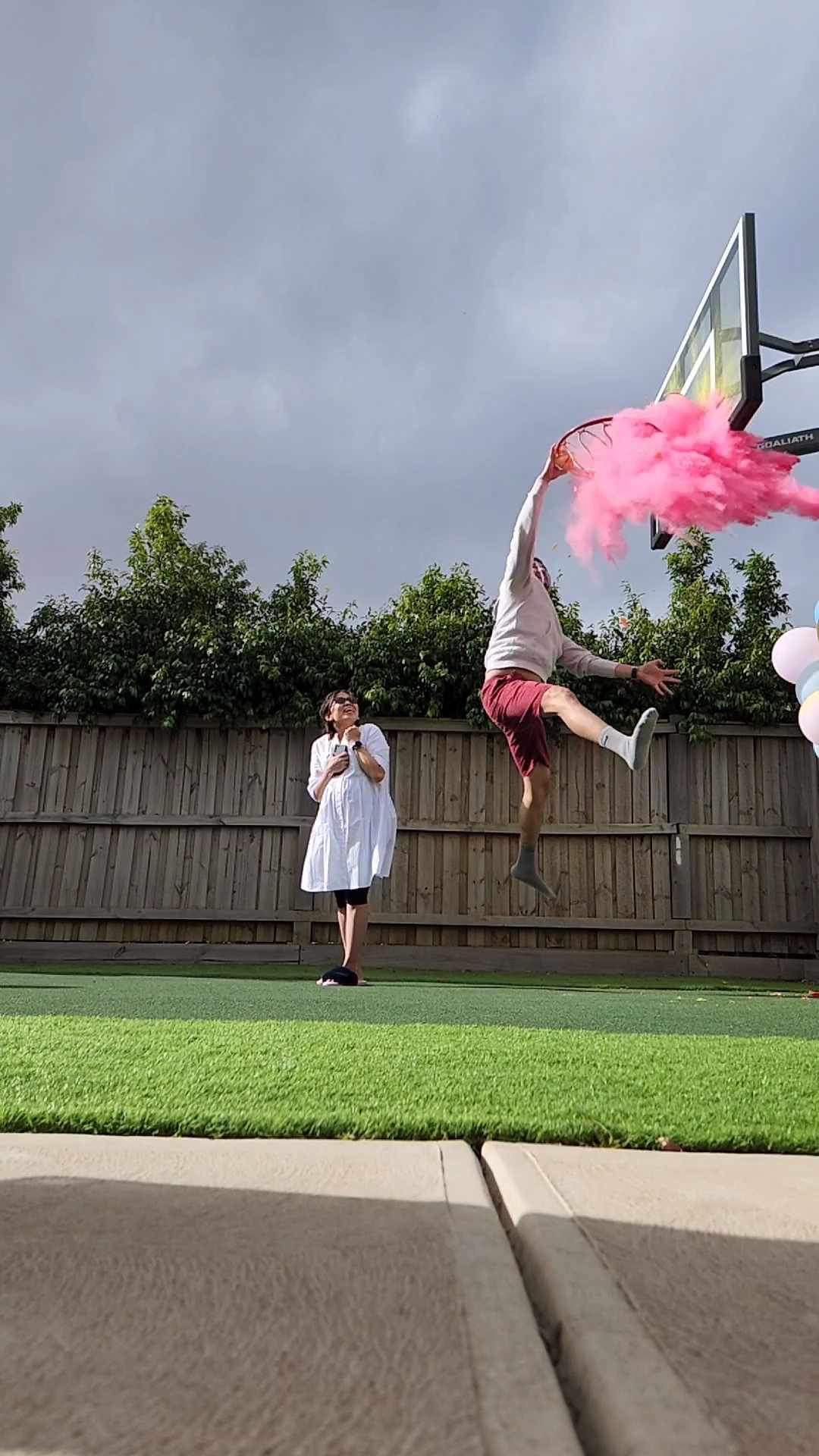 Gender reveal Basket ball slam dunk with pink holi powder